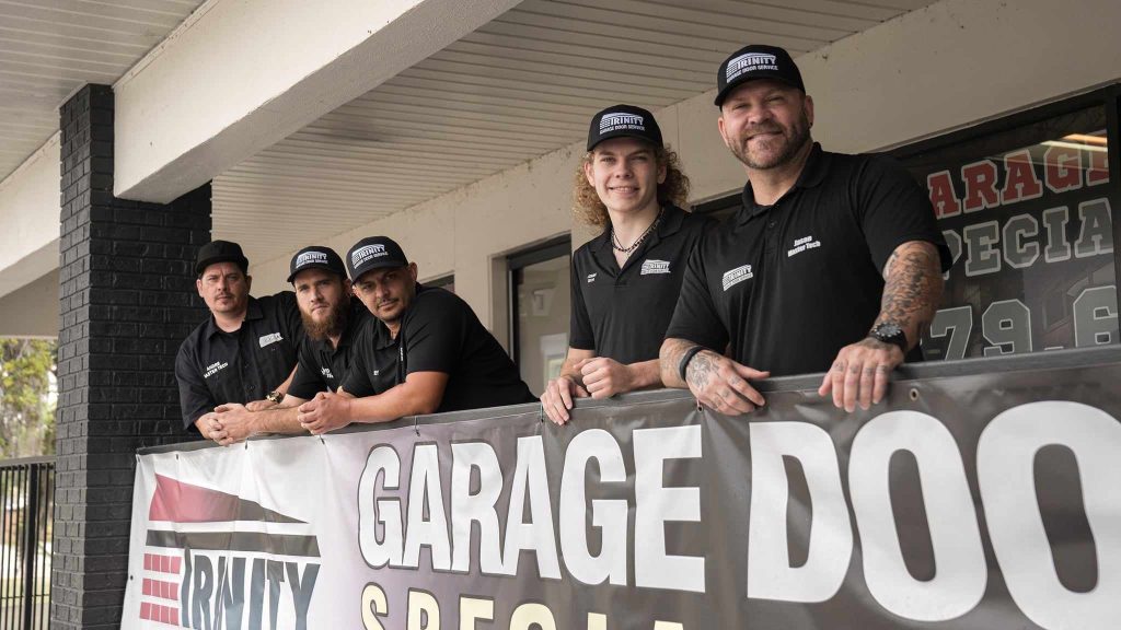 Trinity team with branded banner